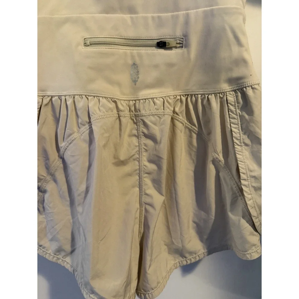 Free People FP Movement Righteous Runsie XS Mineral Bath Cream Romper Cutout